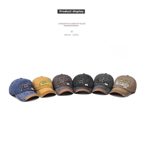 Detail view of washed cotton baseball caps in multiple colors with Los Angeles embroidery