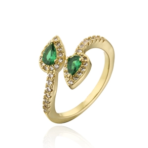 Detailed view of 18K gold plated bypass ring featuring green teardrop zircons and pavé accents