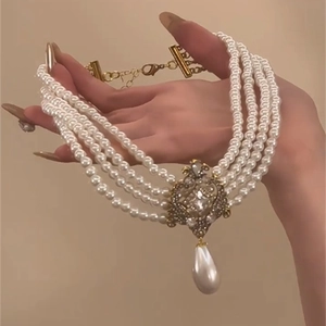 Vintage multilayer pearl choker necklace with gold filigree and teardrop pearl pendant