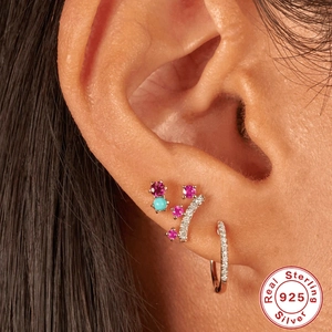 S925 sterling silver crown earring set with pink and blue stones on ear model