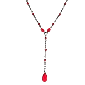 Macro view of Gothic Y-neckline chain with red faceted beads and a blood drop pendant