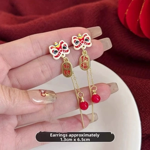 Detailed view of Chinese guardian lion earrings with fortune charms, 1.3cm x 6.5cm size