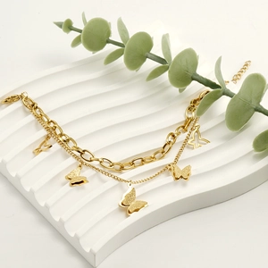 Double-layered 18K gold plated stainless steel bracelet with shiny butterfly pendants