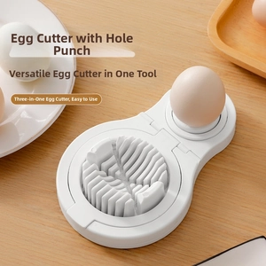 Three-in-one kitchen egg slicer and piercer on a rustic wooden table setting