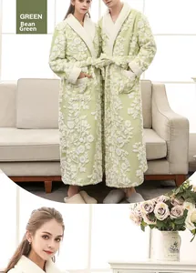 Detail of pea green flannel bathrobe showing white embossed floral texture and contrast collar