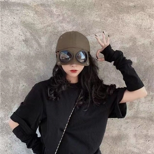 Close-up of olive aviator baseball cap with integrated pilot goggles decoration