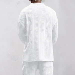 Detailed back view of men's white knit sweater featuring textured jacquard cable pattern