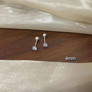 Macro detail of 4mm screw back stud earring with shiny round cut zircon in silver finish