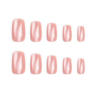 Solid nude pink cat-eye press-on nails set with glossy polarized finish on white background