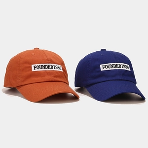 Classic 1986 embroidery baseball cap in vibrant orange and deep navy blue cotton