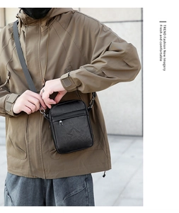 Men's minimalist black PU leather crossbody phone bag with adjustable strap for outdoor use