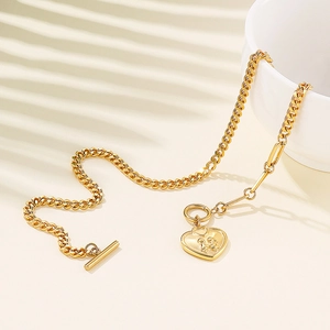 Women's gold titanium steel heart necklace with angel engraving and T-bar toggle clasp