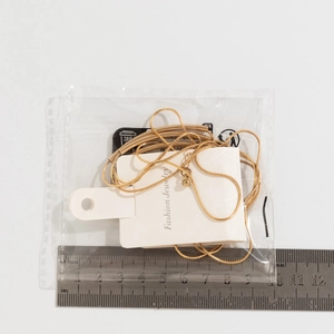 Detailed size measurement of a gold minimalist snake chain necklace with curved bar pendant