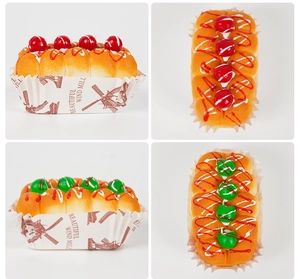 Detail view of slow rebound PU foam cupcakes with fruit toppings and decorative paper cups