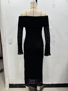 Close-up of elegant black lace fabric and off-the-shoulder long sleeve dress details