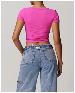 Close-up back view of a slim-fit rose red yoga t-shirt with high-stretch fabric