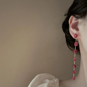 Long strawberry quartz tassel earrings with pink crystals and gold-plated chain fringe