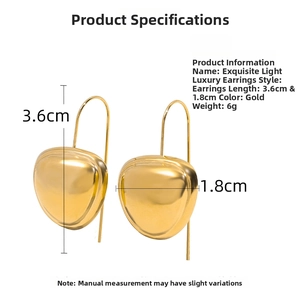 Detail view of gold chubby teardrop earrings showing 3.6cm height and polished finish