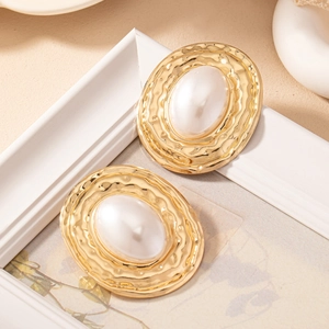 Vintage gold geometric hoop earrings with textured finish and large white pearl accent