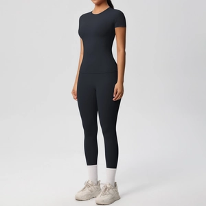 Front view of black two-piece yoga set with short sleeve top and high waist leggings