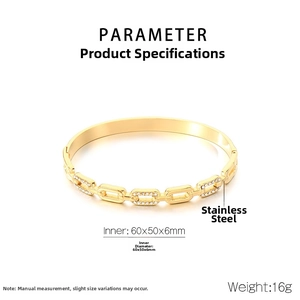 Detail view of gold stainless steel chain bracelet with diamond-set geometric links