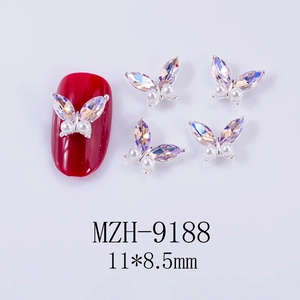 Macro detail of 11x8.5mm aurora butterfly nail art charm with pearls and crystal inlay
