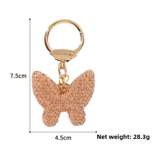 Close-up of champagne crystal butterfly keychain with dimensions 7.5cm by 4.5cm