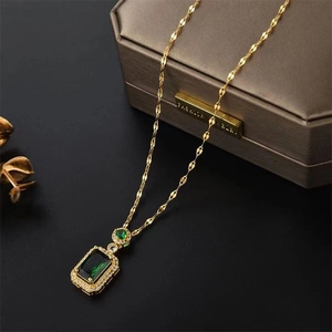 Luxurious emerald green pendant necklace with rectangle crystal and gold chain