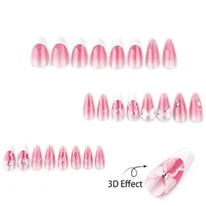 Pink gradient cat-eye press-on nails with 3D bows, pearls and sparkling rhinestones