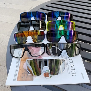Collection of sports cycling sunglasses in multiple colors displayed on a dark background