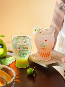 Detail of chill heat-resistant glass cups with cartoon prints and checkered texture base