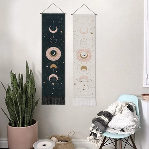 Bohemian celestial lunar eclipse tapestry with sun and moon pattern and fringe details