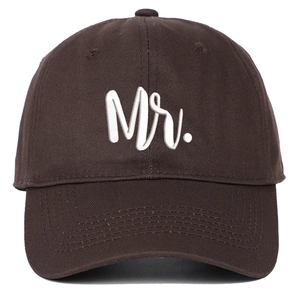 Detailed view of white Mr. embroidery on dark brown twill cotton baseball cap