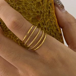 Minimalist gold flower ring set with polished and beaded texture bands for women
