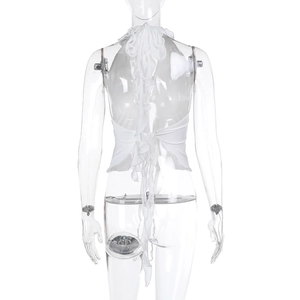 Detail of white halter neck top with layered ruffles and open back design