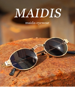 Detail of vintage steampunk sunglasses with gold metal frame and industrial spring hinge