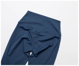 Close-up of high-waist yoga pants featuring V-shaped back seams for a lifting effect