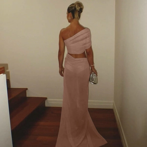 Back view of a pink one-shoulder maxi dress featuring waist cut-out and mesh panel details