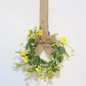Yellow daisy eucalyptus candle ring with burlap bow for spring and wedding party decor