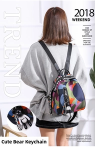 Oxford fabric backpack with colorful geometric patterns and a cute black bear charm