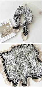 Detail of silk satin square scarf featuring elegant black and white floral geometric prints