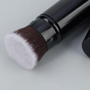 Macro shot of bicolored dense synthetic bristles on a professional flat top foundation brush