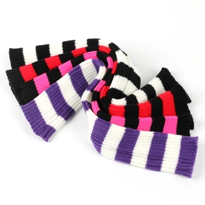 Close-up of colorful striped knit leg warmers showing soft texture and ribbed cuffs