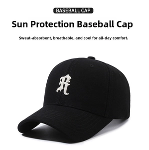 Detailed view of white 3D embroidered R letter on black cotton baseball cap