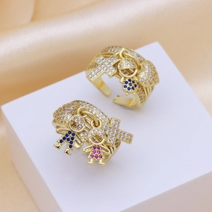 Gold plated copper open ring featuring boy and girl charms with cubic zirconia stones