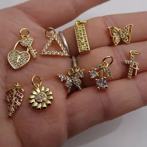Gold-plated mini charms set with heart, butterfly and cherry shapes for jewelry making
