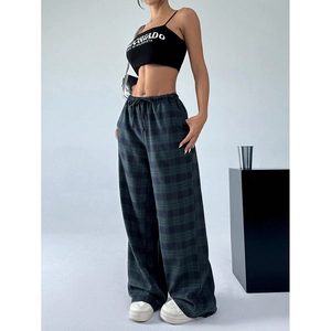 Men's relaxed plaid trousers with drawstring waist and pockets in a dark classic pattern