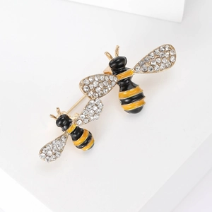 Cute gold bee brooch set with black and yellow enamel wings and sparkling crystals