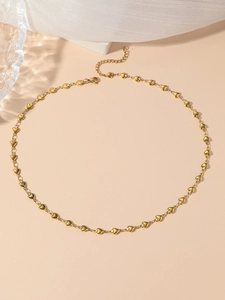 Detail of gold titanium heart necklace showing lobster clasp and adjustable chain
