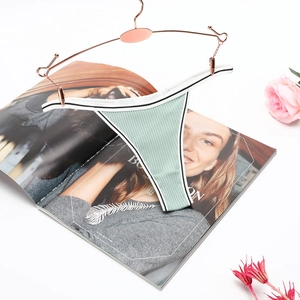 Mint green ribbed cotton T-back thong for women displayed on a rose gold hanger